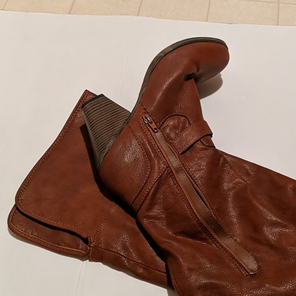 Over the knee brown boots.